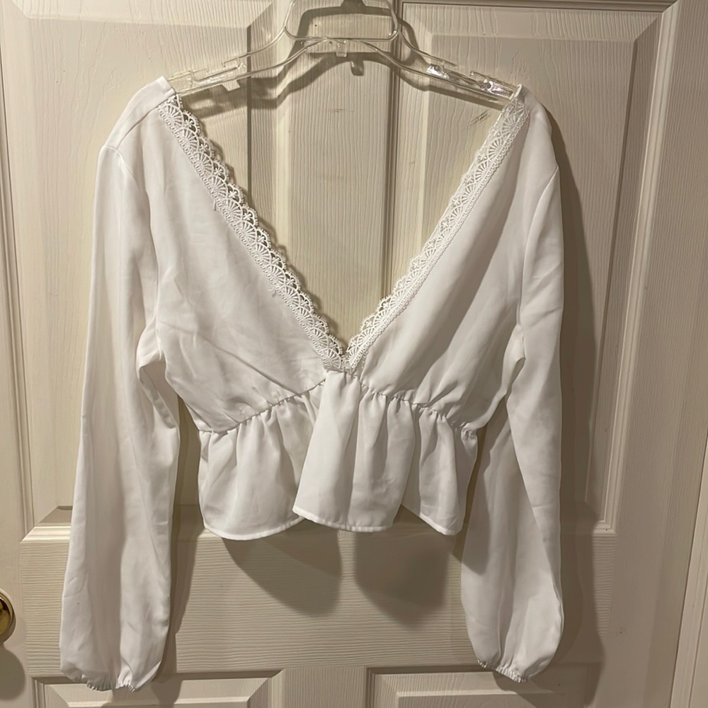 “Zaful” plunging neckline white blouse, size medium.